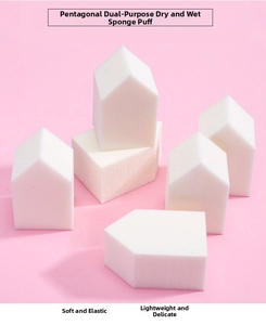 Macro shot of white house-shaped non-latex makeup sponges for wet and dry cosmetic use