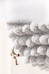 Close-up of thick grey chenille bath mat showing non-shedding durable fiber texture