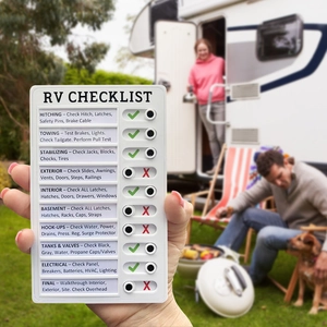 Detail of RV checklist showing sliding mechanical buttons for travel maintenance tracking
