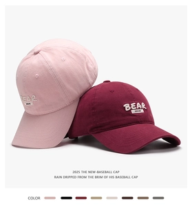 Detailed close-up of 3D letter embroidery and premium cotton texture on baseball caps