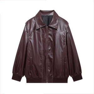 Detail of burgundy PU leather bomber jacket with white contrast stitching and zip closure