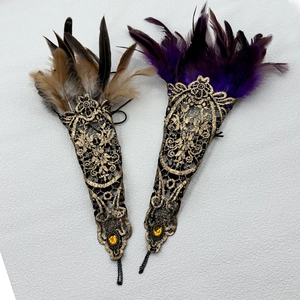 Gothic lace feather wrist cuffs with gold trim and purple or brown gemstone accents