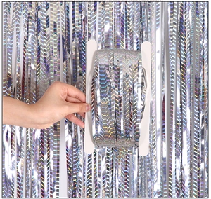 Detail of silver holographic fringe curtain wrapped on a card for party decoration