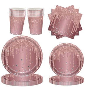 Close-up of rose gold sequin dripping design on party paper cups and plates