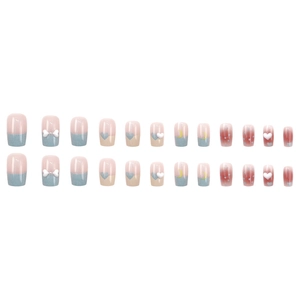 Short square press-on nails with 3D bows, moons, and pink polka dot heart designs