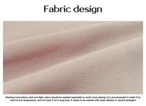 Close-up of pink fabric texture showing weave details and washing instructions text