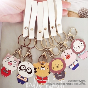 Detail view of six cute PU leather cartoon animal keychains with metal lobster clasps