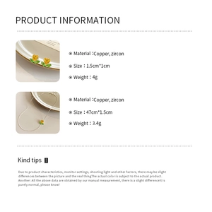 Makro-Detail von gelbem Herz-Zirkon-Schmuckset mit goldenen Blättern und Produktmaßen