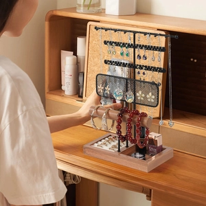 Multifunctional jewelry organizer stand with black metal mesh and wooden base for necklaces