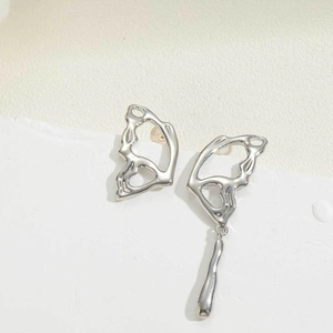 Asymmetric silver hollow butterfly wing stud earrings with long tassel pendant details