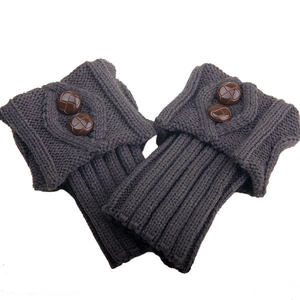 Detail of dark grey knit leg warmers showing diamond texture and brown buttons