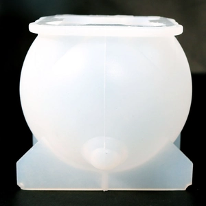 Macro detail of translucent spherical silicone pig resin mold with square pouring opening