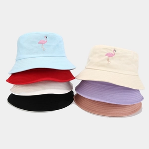 Colorful cotton bucket hats with flamingo embroidery shown in multiple pastel shades