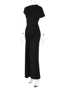 Detail showing side waist ruching and stacked hemline on this black slim fit dress
