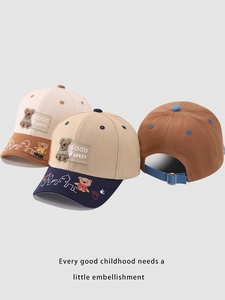 Detail of adjustable metal buckle and blue strap on cartoon bear cotton baseball cap