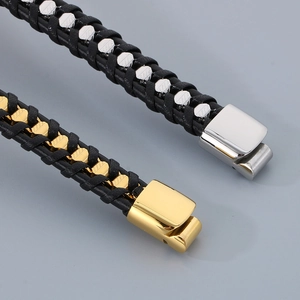 Macro detail of men's braided leather bracelets with gold and silver magnetic clasps