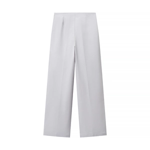 Detailed view of high-waisted wide-leg grey trousers with elegant professional drape