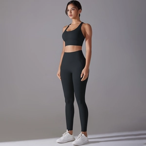 Close-up detail of black antibacterial yoga set showing high-waisted leggings and sports bra