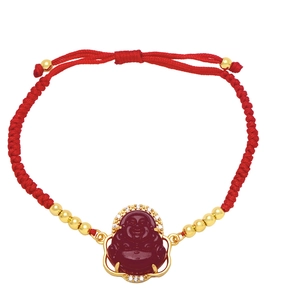 Detail of red braided rope bracelet with gold beads and a red Maitreya Buddha pendant