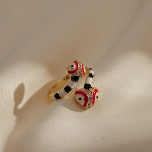 Macro shot of 18K gold plated snake ring with colorful enamel inlay and sparkling crystals