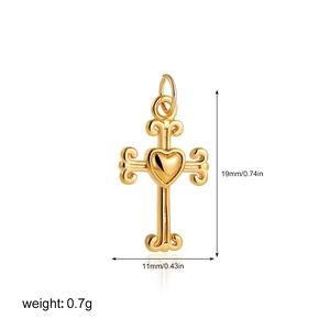 Detailed view of 18K gold cross heart pendant with 19mm height and 0.7g weight specs