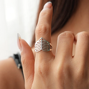 Detail of silver geometric hollow index ring with minimalist leaf vein texture and pattern