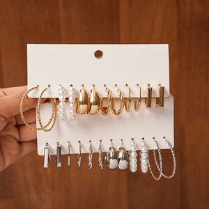 12-pair gold and silver geometric hoop earring set with pearls on display card