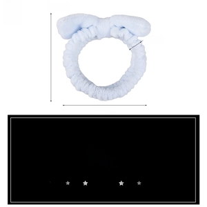 Detail of light blue plush bow headband with dimensions showing elastic fabric and soft texture