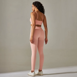 Detail of pink seamless knit yoga set showing breathable mesh texture and cross back design