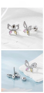 Macro detail of butterfly stud earring featuring zircon inlay and screw-back closure