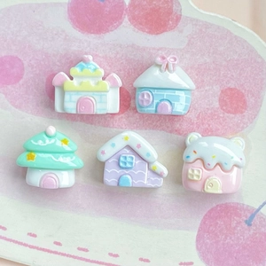 Miniature colorful resin castle and house charms for DIY crafts on a cherry pattern plate