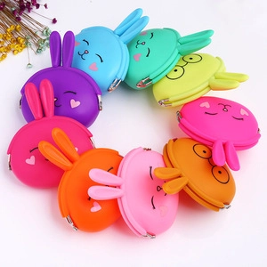 Colorful bunny silicone coin purses in various bright colors with cute cartoon faces