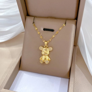 Luxurious gold-plated teddy bear pendant necklace with sparkling crystals in jewelry box