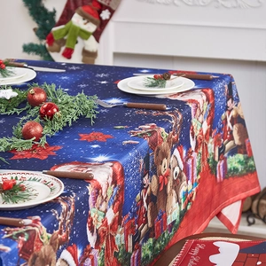 Christmas tablecloth featuring festive reindeer and nutcracker patterns on a set dining table