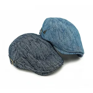 Fashionable denim jacquard flat caps in light and dark blue with side metal buckles