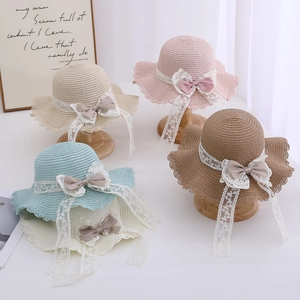 Kids woven straw sun hats with wavy lace edges and bows in assorted colors