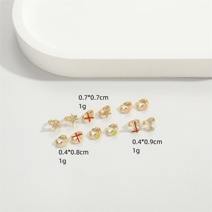 Delicate gold star and geometric dangle hoop earrings set with sizing details
