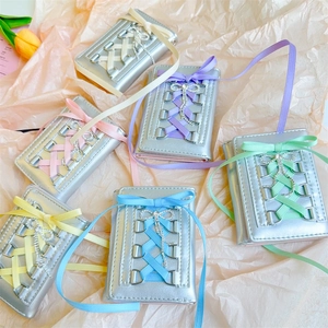 Metallic silver PU wallet with balletcore ribbon lace-up and rhinestone bow details