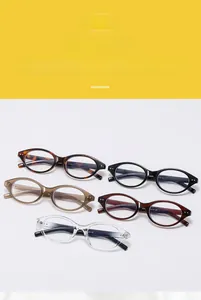 Collection of retro oval eyeglasses frames in black, tortoiseshell, and transparent colors