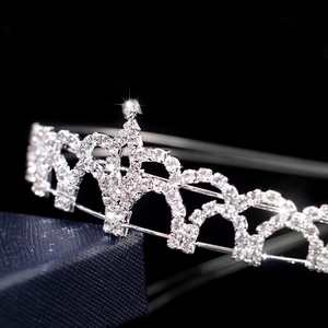 Close-up of sparkling rhinestones on a silver metal bridal tiara in a gift box