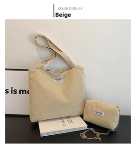 Detail of beige corduroy tote bag set with a matching chain pouch and fashion label