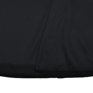 Close-up of the black satin fabric texture and precise stitching detail on the skirt hem