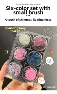 Six-color glitter eye shadow set in transparent case with brush and star shapes
