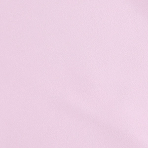 Macro detail of soft pink satin fabric texture showing smooth glossy silk-like finish