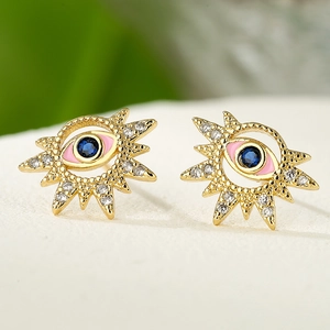 Detailed view of 18K gold plated evil eye stud earrings with blue gems and pink enamel