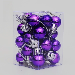 Set of shiny purple Christmas ball ornaments with silver caps in a transparent box