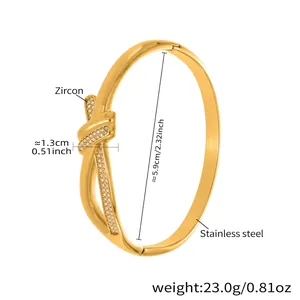 Detail shot of golden stainless steel knot bracelet with micro-paved zircon stones