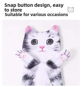 Close-up of cat-shaped hand towel showing durable white snap button for easy hanging