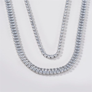 Elegant silver-tone tennis necklace set with rectangular cut sparkling crystals