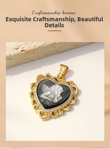 Detailed view of a gold heart pendant featuring a shell base and angel relief